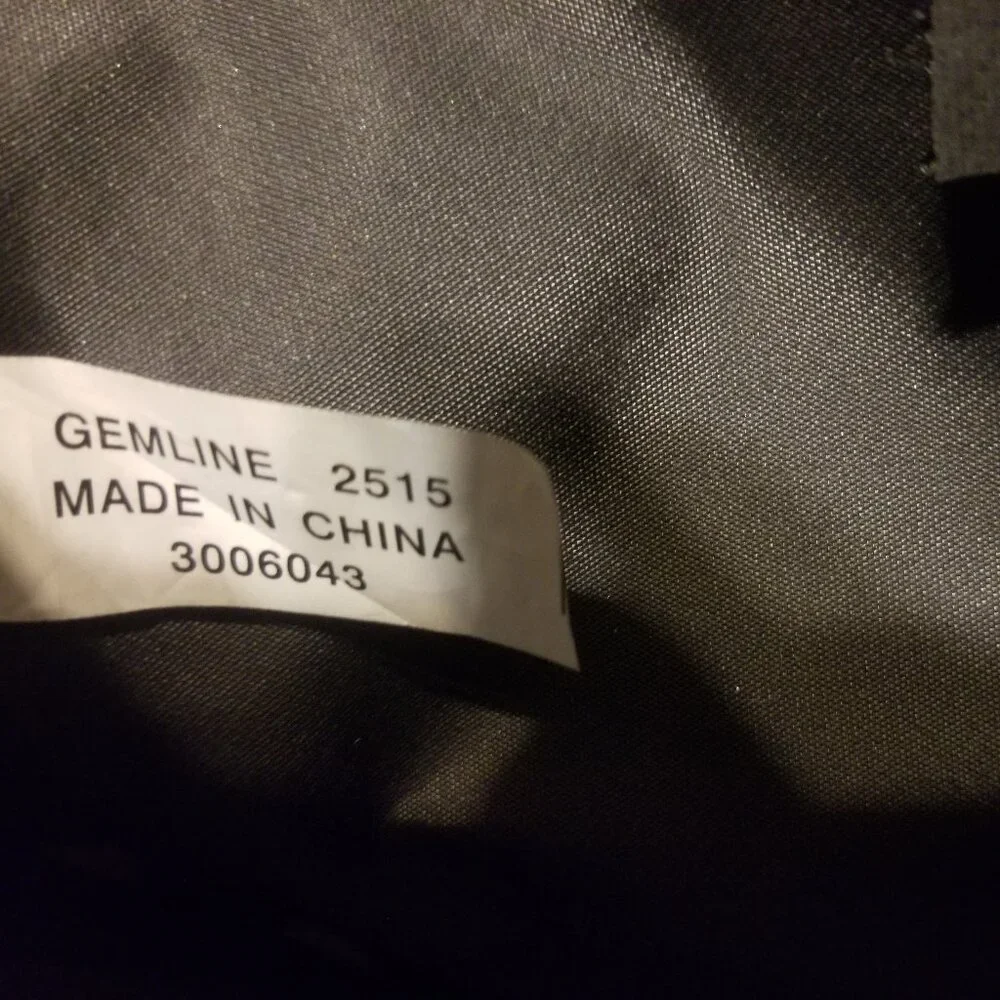 large black bag with straps, and ink-stained interior